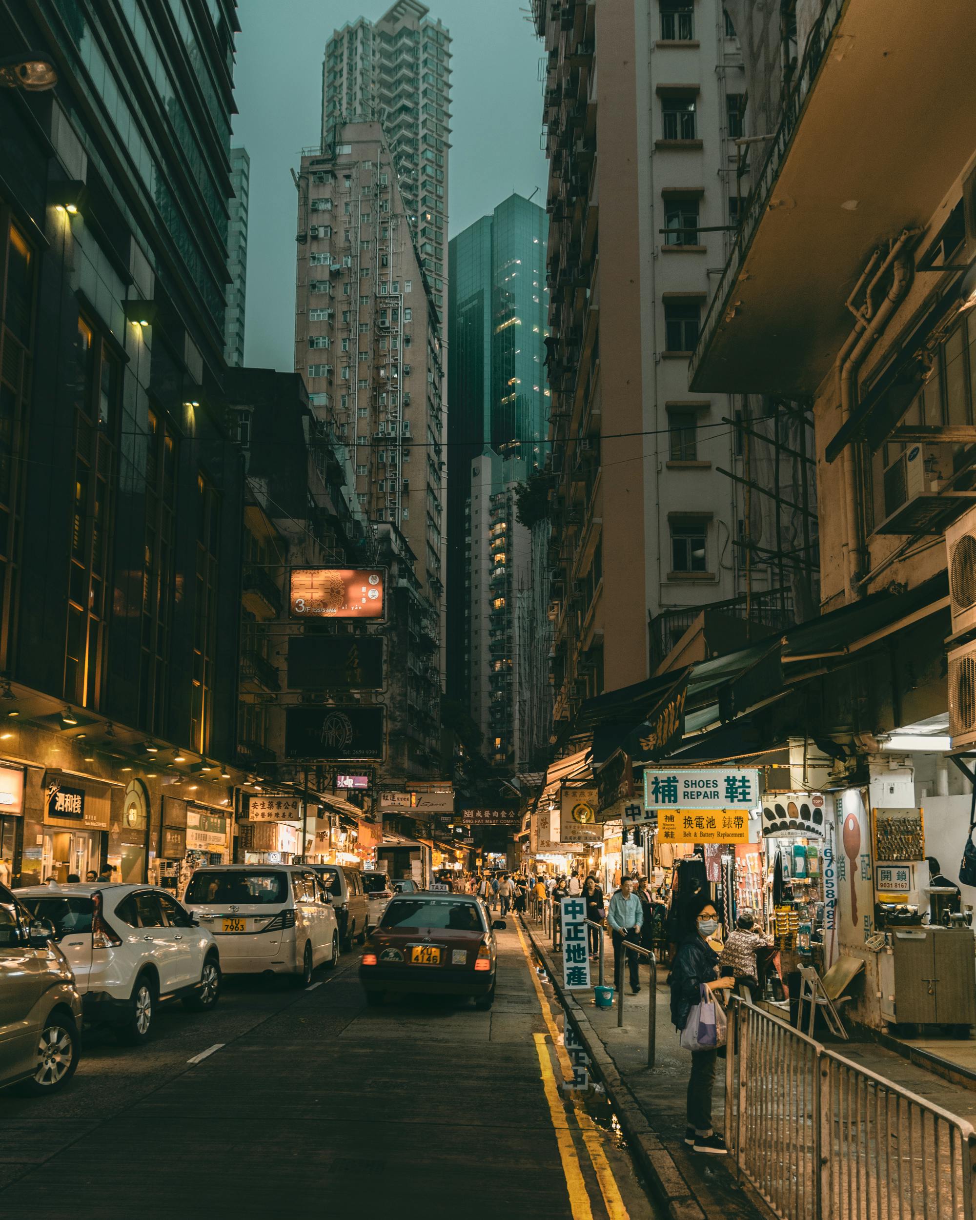 Discover the bustling nightlife and vibrant street scene of Kowloon, Hong Kong's busy shopping district.