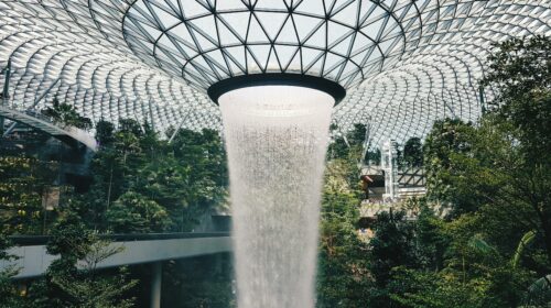 Stunning view of the indoor waterfall at Jewel Changi Airport, Singapore's architectural marvel.