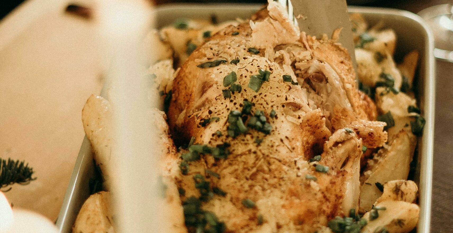 A delicious roast turkey being carved for a festive dinner, perfect for holiday gatherings.
