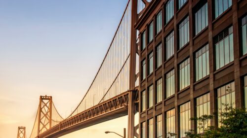Stunning view of the Bay Bridge from downtown San Francisco at sunrise.